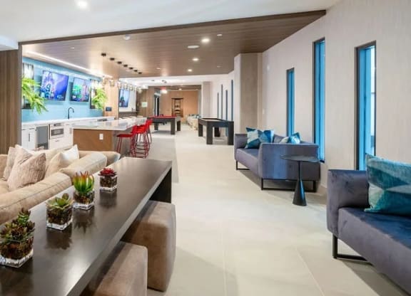 a living room with couches and a table