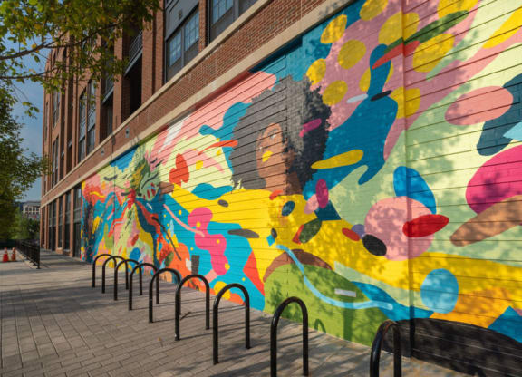 a colorful mural on the side of a building