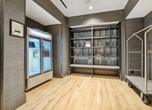 a room with wood flooring and a bookshelf filled with books