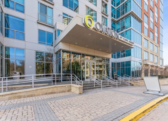 an office building with a large ovation sign on the front of it