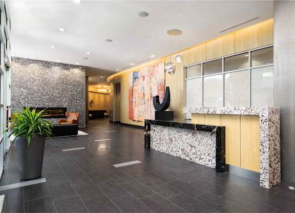 the lobby of a hotel with a reception desk