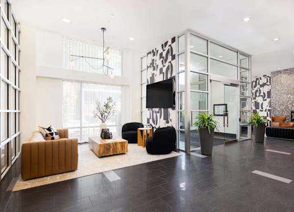 a living room with couches and a tv