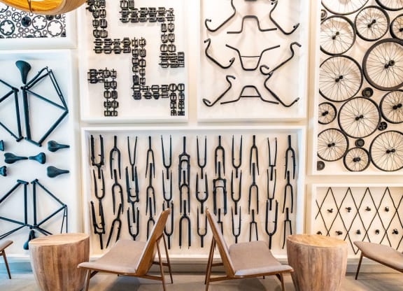 a room filled with chairs and art on the wall