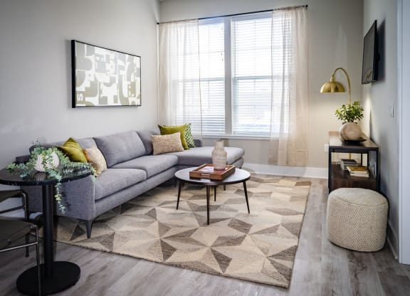 a living room with a couch and a table