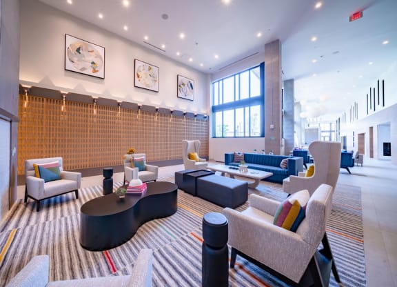a living room with couches and chairs and a fireplace