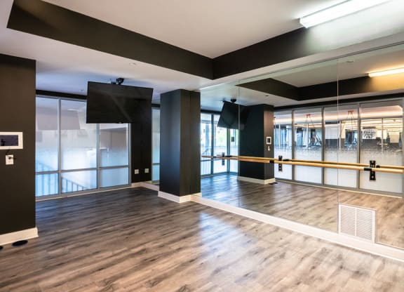 a large room with a wooden floor and glass doors