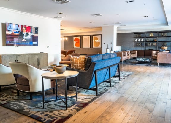 a living room filled with furniture and a tv