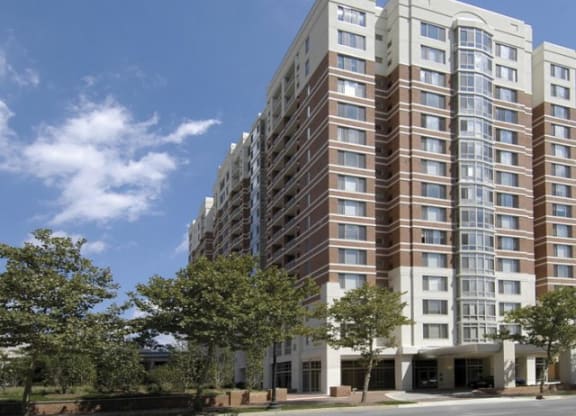 a large apartment building on the side of a street