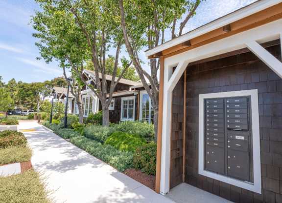 outdoor mailbox area with courtyard walkway