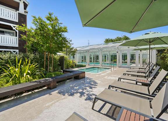 pool deck with outdoor seating and courtyard views