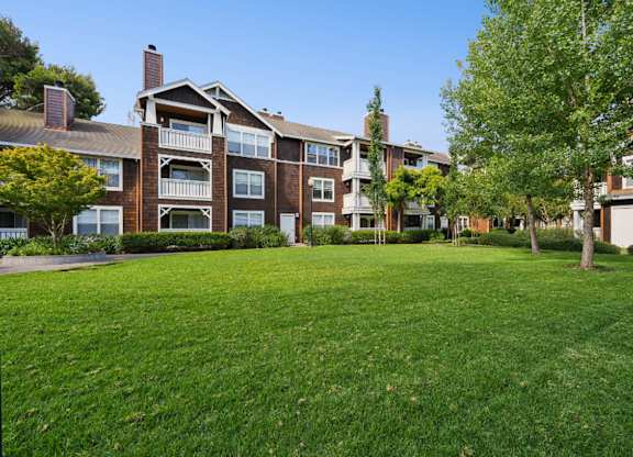 landscaped apartment grounds with greenery and pathways