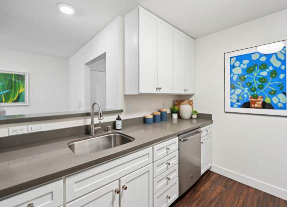 apartment kitchen with cabinetry and updated finishes