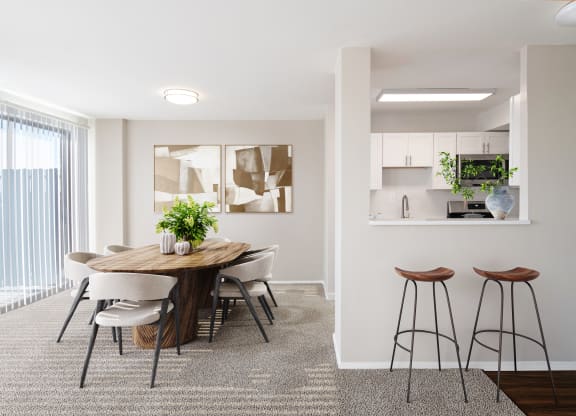 a dining room with a table and chairs and a kitchen