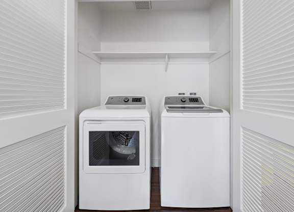 Two white appliances in a small kitchen.