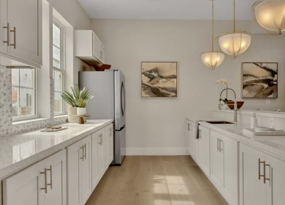 Community kitchen with white finishes and spacious counters at Brandywine Crossing, Brandywine, MD 20613