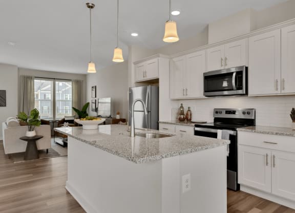 Kitchen with large island looking into living room at Brandywine Crossing, Brandywine, MD 20613