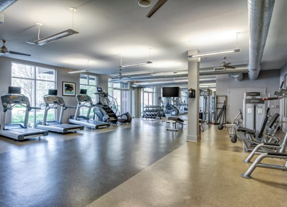 a gym with cardio machines and other exercise equipment
