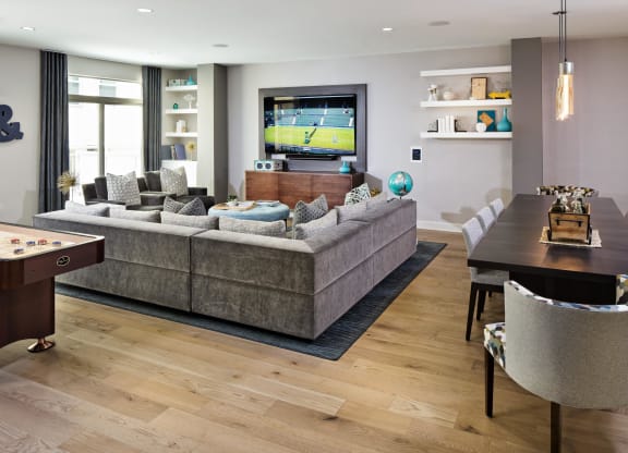 a living room with a couch and a table and a television