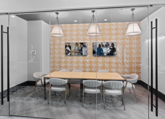 a dining room with a wooden table and chairs