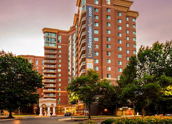 A large multi-story building with the text LiveAndLoveApartments.com on the side.