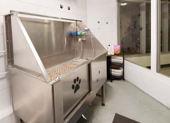 A large stainless steel machine with a paw print on it.