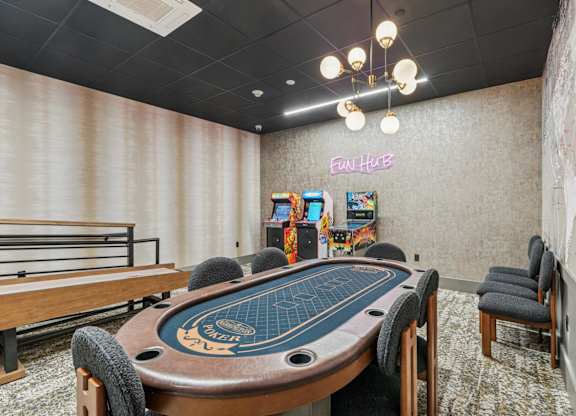Game room with card table and arcade games