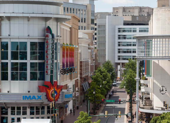 an aerial view of a city street with buildings and malls