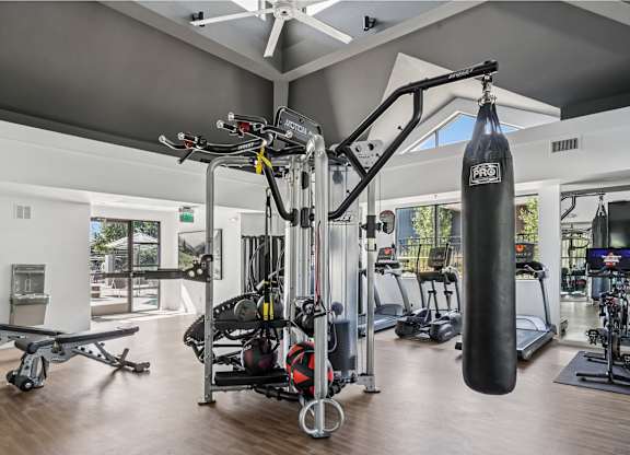 A gym with a variety of equipment including a punching bag at The Magwood in Boulder, Colorado.