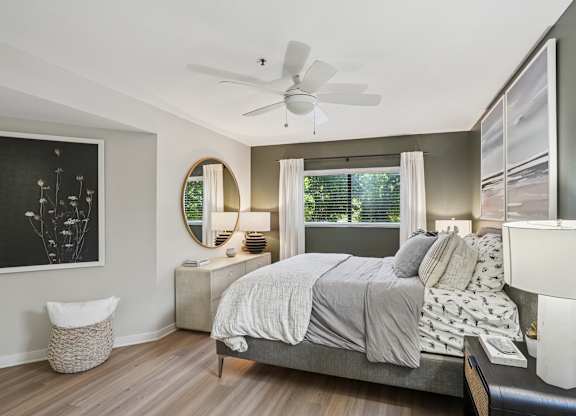 A bedroom with a bed, nightstand, and a fan at The Magwood in Boulder Colorado