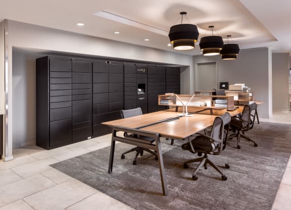 a conference room with a table and chairs and a black closet