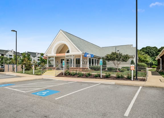 the front of a church building with a parking lot