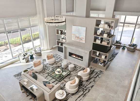 A modern living room with a fireplace and a large window.