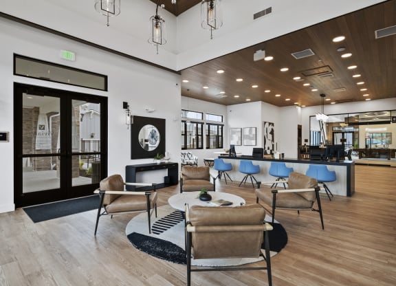 a lobby with chairs and tables
