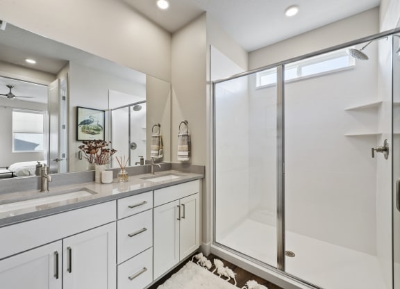 Decorated bathroom with glass walk in shower