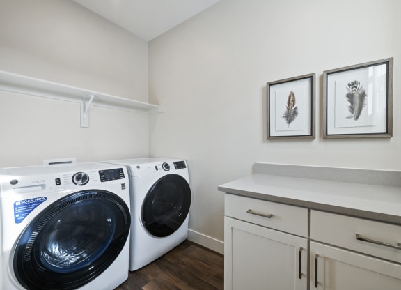 Laundry room with cabinets and counterspace