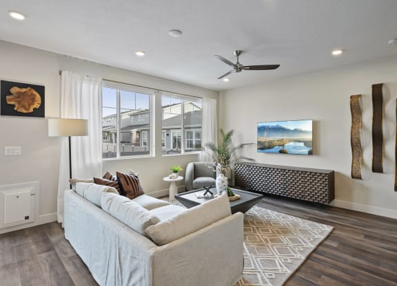Decorated living space with ceiling fan