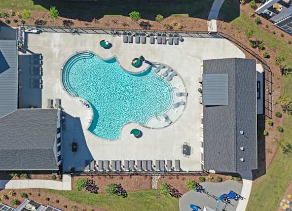 An aerial view of a house with a blue pool in the backyard.at 198 Milltown Apartments, Burlington  