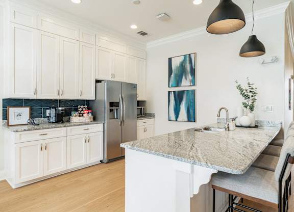 A kitchen with a marble countertop and a refrigerator. at Concord Ridge Apartments, Concord, NC, 28027
