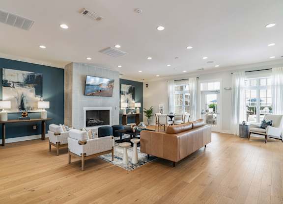 A living room with a fireplace and a couch. at Concord Ridge Apartments, Concord, NC