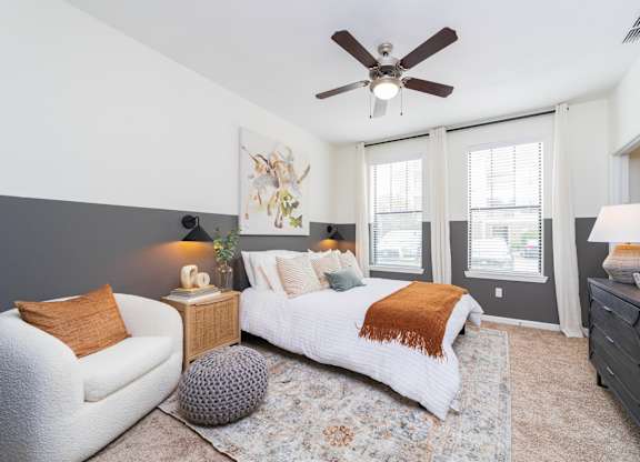 a bedroom with a large bed and a ceiling fan at Terraces at Town Center, Jacksonville
