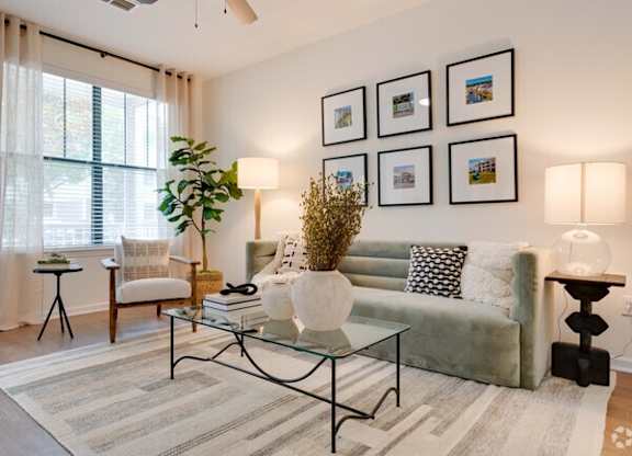 a living room with a couch and a table at Terraces at Town Center, Florida, 32256