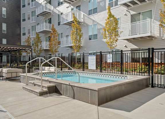 Luxury Studio Apartments Hopkins MN  - The Hallon - Hot Tub/Spa with Nearby Patio Furniture, and Maintained Landscaping