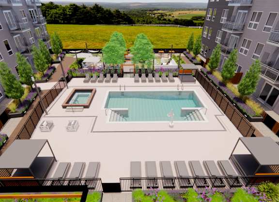 an aerial view of an apartment complex with a swimming pool