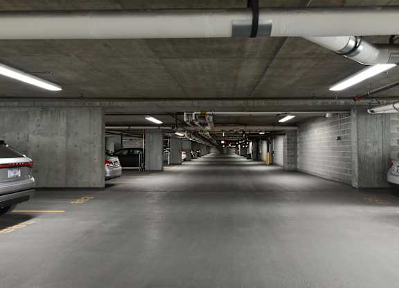 the inside of a parking garage with cars at Optima Old Orchard Woods, Skokie, Illinois