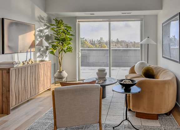 A living room with a brown chair and a small table.