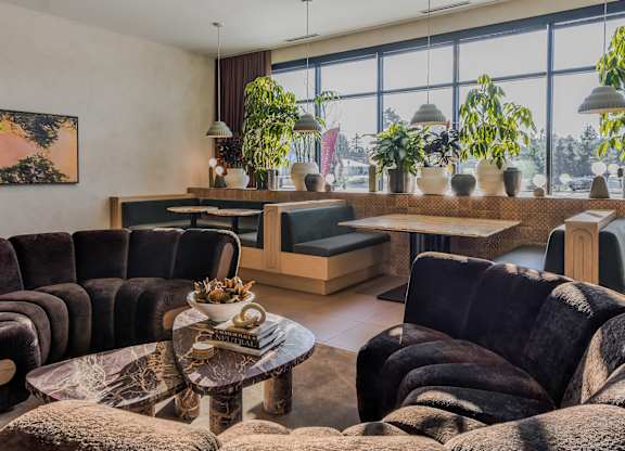 A living room with a large couch and a coffee table.
