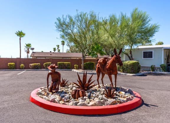 a statue of a horse and a man in a round garden