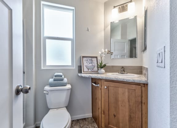 an empty bathroom with a toilet and a sink