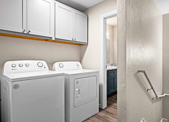 A laundry room with a washer and dryer.