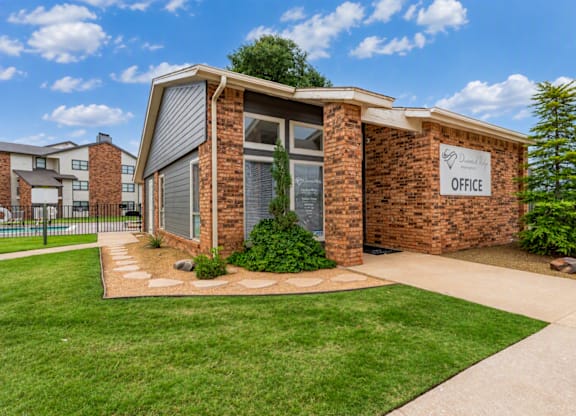 A small brick building with a sign that says